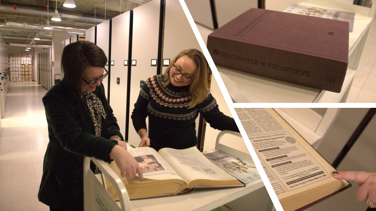 Two women looking at an open book