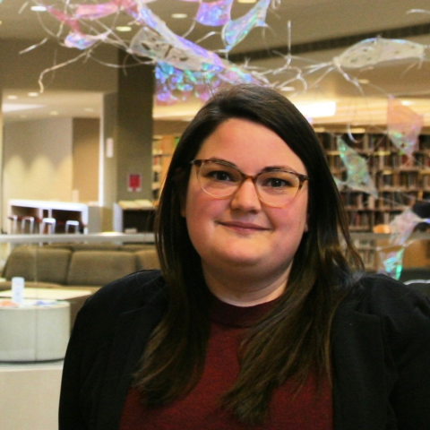 Photo of Shauna Winter. A woman with glasses and long dark hair